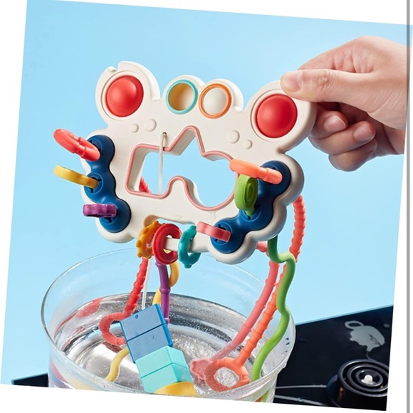 Baby👶🏻Pull String Pumping Teether Sensory Tummy Time & Fine Motor Skills Toy - Picture 9 of 11